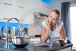 Pretty, young woman in her  kitchen