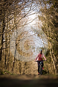 Pretty, young woman with her mountain bike