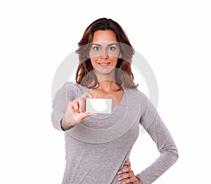 Pretty young woman holding blank business card