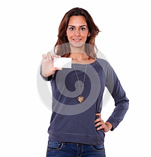 Pretty young woman holding a blank business card