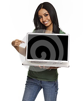 Pretty young woman holding laptop