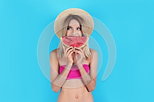 Pretty young woman with juicy watermelon