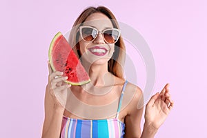 Pretty young woman with juicy watermelon