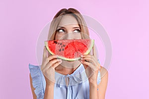 Pretty young woman with juicy watermelon