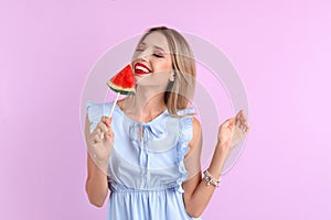 Pretty young woman with juicy watermelon