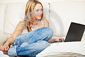 Pretty young woman with laptop computer