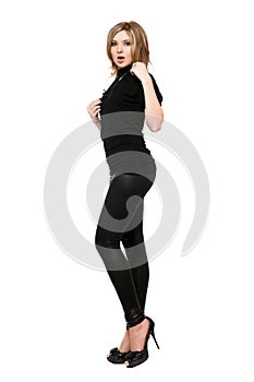 Pretty young woman in leggings. Isolated on white