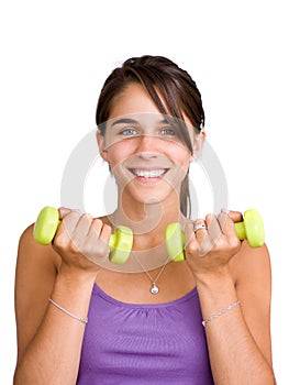 Pretty young woman lifting dumbbells