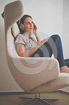 Pretty, young woman listening to her favorite music