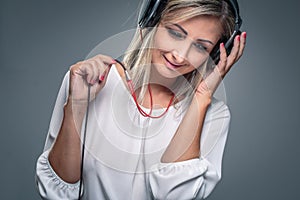 Pretty, young woman listening to her favorite music