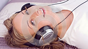 Pretty young woman listening to music and flirting