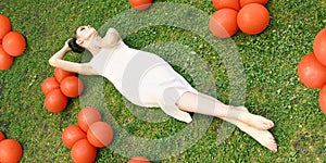 Pretty young woman lying down on grass. Fashion model