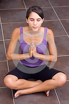 Pretty young woman meditating