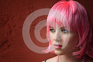 Pretty young woman with pink hair