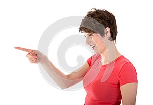 Pretty young woman pointing with her finger