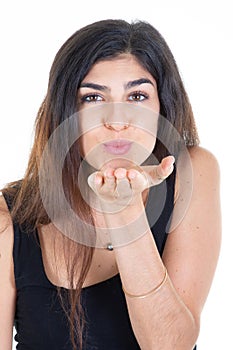 Pretty young woman pout lips sending you hot gentle kiss isolated white background