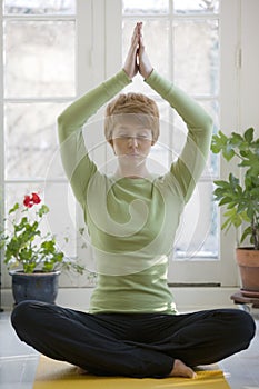 Pretty young woman practicing yoga