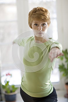 Pretty young woman practicing yoga