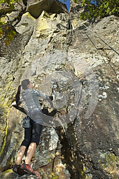 Pretty Young Woman Rock Climbing