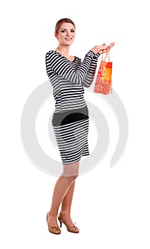 Pretty young woman with shopping bag over white