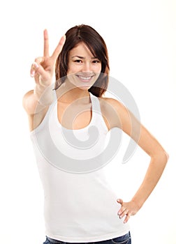 Pretty young woman showing the peace sign