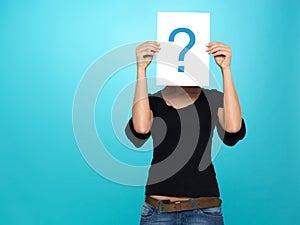 Pretty young woman showing a question mark