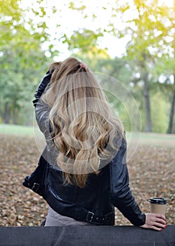 Pretty Young Woman Sitting Bench Autumn Park Reading a Book on Digital Device Relax Leisure