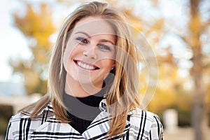 Pretty Young Woman Smiling in the Park