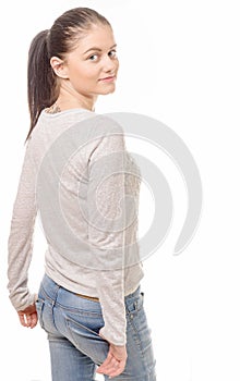 Pretty young woman standing on white background, back view