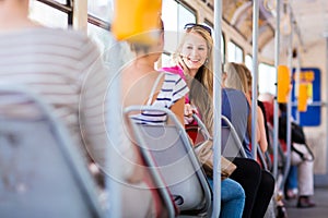 Pretty, young woman on a streetcar/tramway