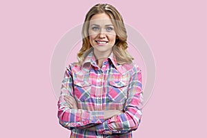 Pretty young woman in stylish shirt posing at camera on color background.