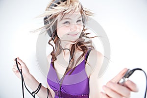 Pretty young woman/teenager listening to music