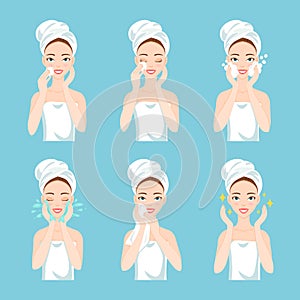 Pretty young woman with a towel around her head and body remove make-up, clean, wash and care her face with sponge. photo