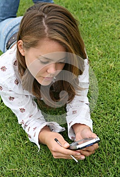 Pretty Young Woman using a PDA