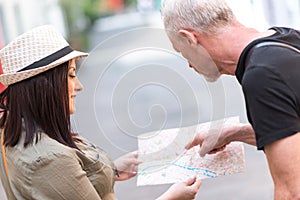 Pretty young woman asking for direction