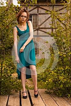 Pretty young women posing on wooden platform in castle