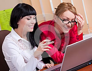 Pretty young women at workplace