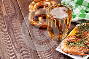 Pretzel, beer mug and grilled shrimps