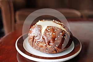 Pretzel Kaiser bun with sesame seeds