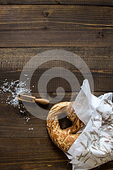 Pretzel with Sea Salt on Rustic Wooden Background