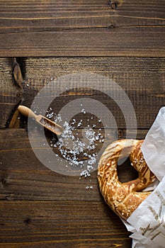 Pretzel with Sea Salt on Rustic Wooden Background