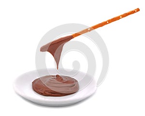 Pretzel sticks dipped in chocolate cream isolated on white