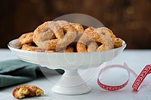 Pretzel cookies with sugar on a Christmas background. Sugar cookies.