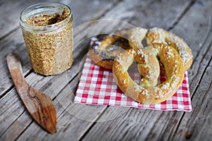 Pretzels with wholegrain mustard, food snack bread picnic