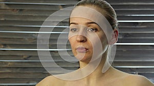 Prevention of skin aging, woman performs exercises for a face building. strengthening the muscles around the lips