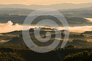 Previously foggy September morning in Tuscany. Surroundings of San Gimignano, Italy