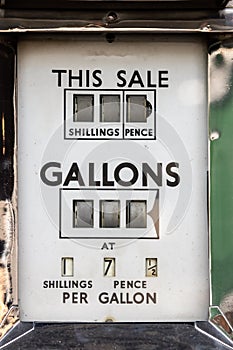 The price of petrol. Vintage car fuel meter priced in shillings