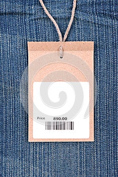 Price tag with barcode on jeans