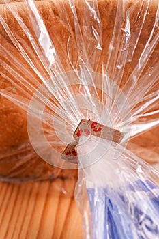 Price Tag Bread Clip on white background. Recycled cardboard paper tags on bread bag use to tell you which day of the week bread