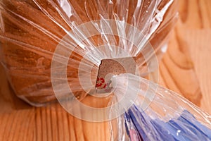 Price Tag Bread Clip on white background. Recycled cardboard paper tags on bread bag use to tell you which day of the week bread